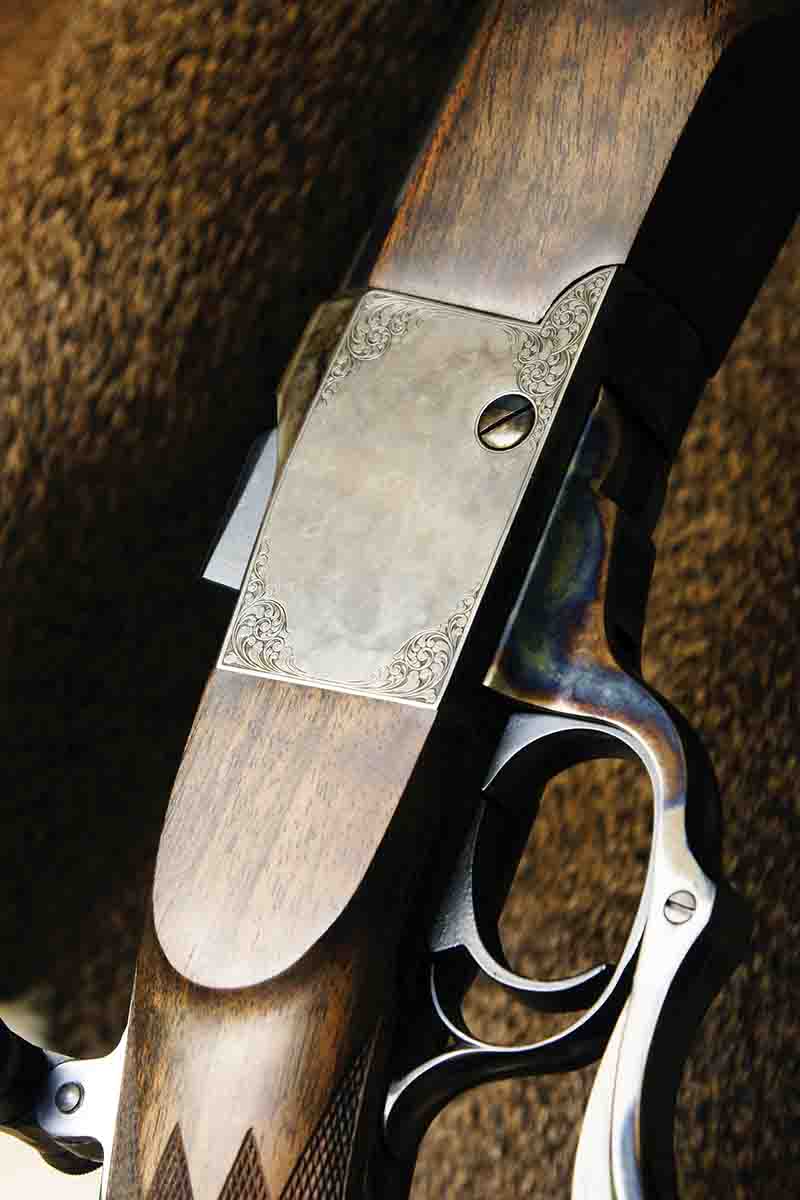 Minimalist engraving on a newly made single-shot, long-range rifle built on a modified Ruger No. 1 action. The engraving is 1890’s-style American scroll by Sam Welch. Combined with subdued case-hardening, the effect is both restrained and  refined. The scroll breaks up the flat steel surface just enough.